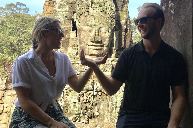 A Day Angkor Wat Sunrise Tour, Ta Prohm & Hidden Gems Beng Mealea - Bayon and the stone faces of Angkor Thom