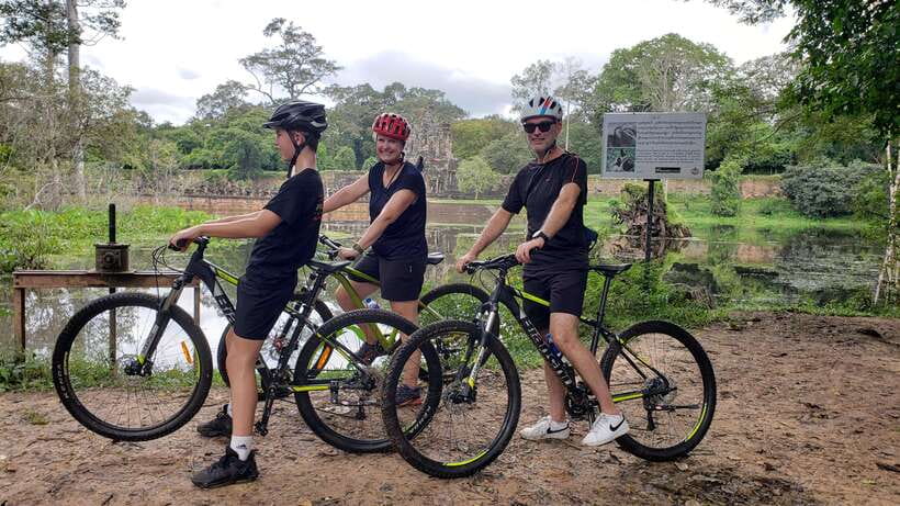 Angkor Jungle Biking Adventure Private Cycling Tour - Angkor Thom, gates, walls, and the Bayon faces