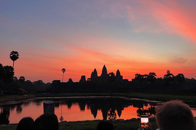 Angkor Sunrise Bike Tour with Lunch Included - Bayon’s many stone faces