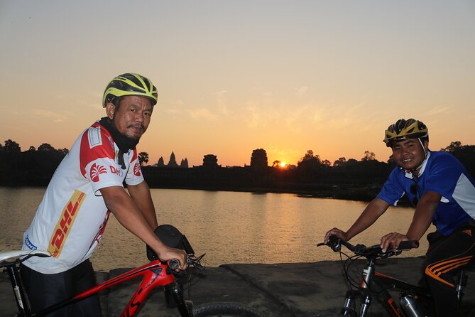 Angkor Sunrise Expedition Cycling Through Serene Backroads - The faces of Bayon finish the morning