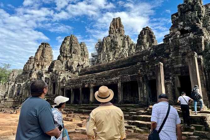 Angkor Wat 1-Day Tour by Private Car or Minivan - Entering Angkor Wat and reading the stone