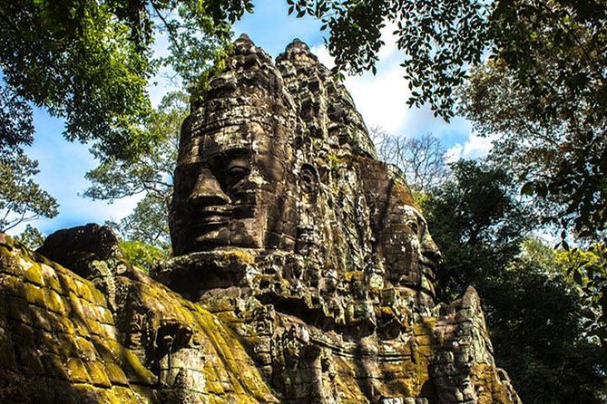 Angkor Wat highlight Tour From Sunrise -Small Group - Bayon’s central towers and carved faces