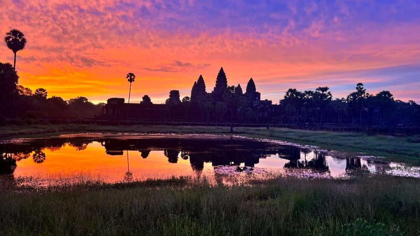 Angkor Wat: Highlights and Sunrise Guided Tour - Angkor Wat sunrise from the reflection pools