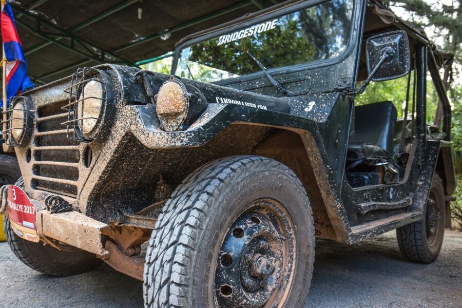 Angkor Wat in a vintage Jeep with driver - jeep rental - Ta Prohm and the trees over the ruins