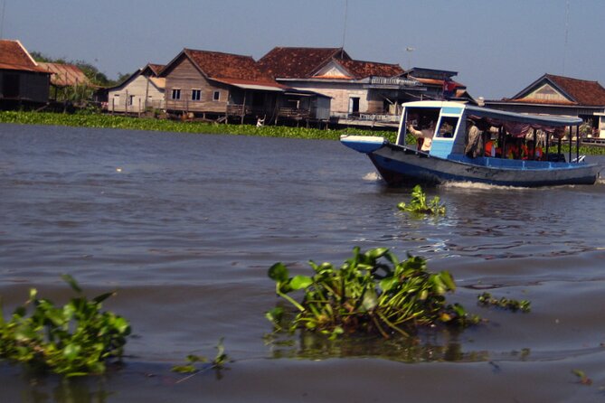 Angkor Wat Sunrise and Tonle Sap Cruise Sunset Tour - From ancient stone to Tonle Sap’s floating community