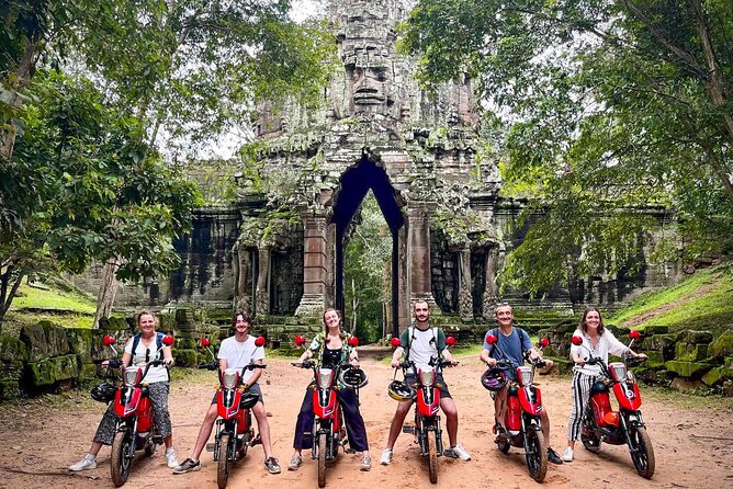 Angkor Wat Sunrise Tour By E-Bike Experience With Breakfast Included - Ta Prohm and the tree-covered ruins
