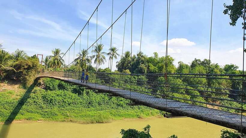Battambang: Tuk-Tuk, Bamboo Train, Killing/Bat Caves, Sunset - Villages, plantations, rice fields, and a shaky bridge