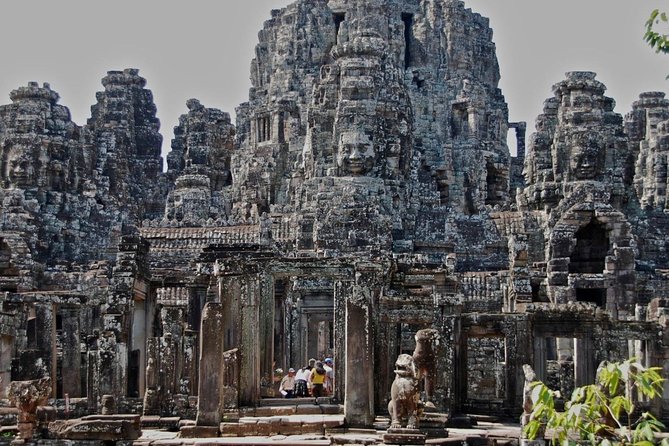 Four-day tour Angkor Wat, Banteay Srey, Beng Melea and Siem Reap discovery - Day one: Bayon faces, Ta Prohm roots, and Angkor Wat