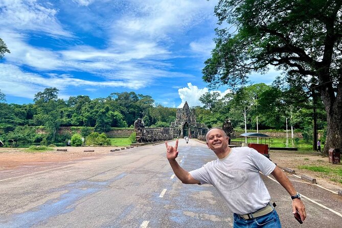 Full Day Tour Phnom Penh to Siem Reap Taxi, Angkor Visit & Return - Ta Prohm, roots and ruined walls