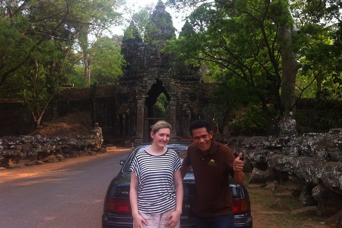 One Day Angkor World Heritage Tour - Angkor Thom and Bayon: a city gate followed by stone faces