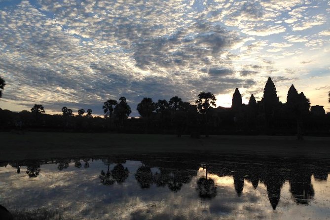 One Day tour with sunrise in car with A/C or Van & Guide. - Bayon and the gates of Angkor Thom