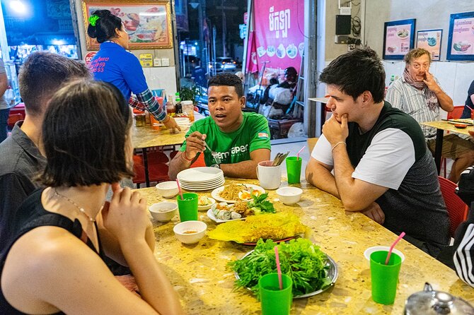 Phnom Penh Evening Food Tour - Inclusive 5 stops local Tastings - Phnom Penh Night Market: food, silk, and shopping