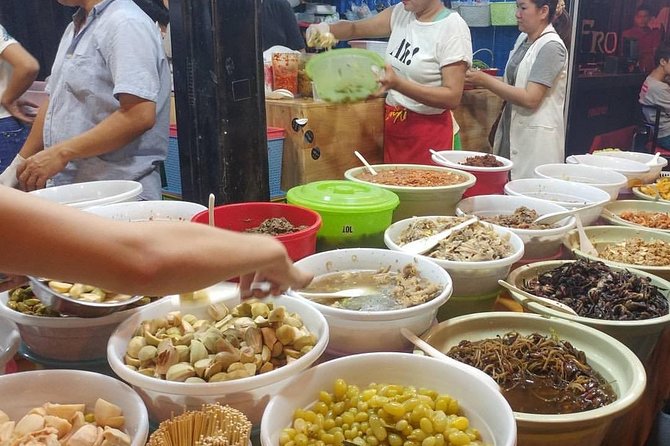 Phnom Penh Nightlife Street Food Tours - Kandal Market: grilled food near the river