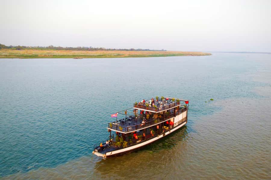 Phnom Penh: Sunset Cruise with Unlimited Beer &Fruit platter - Drinks, fruit and the change from commentary to music