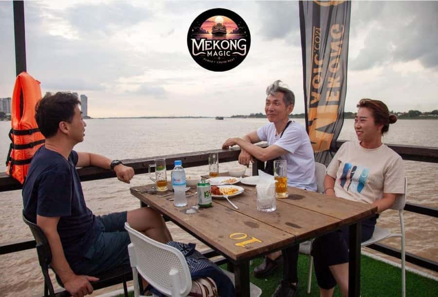 Phnom Penh: Sunset Cruise with Unlimited Beers & BBQ Buffet - Sunset at the Tonle Sap and Mekong meeting point