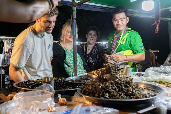 Siem Reap Evening Food Tour - Inclusive 5 stops Local Tastings - Stop three: herbs, spring rolls, fruit, and BBQ snails