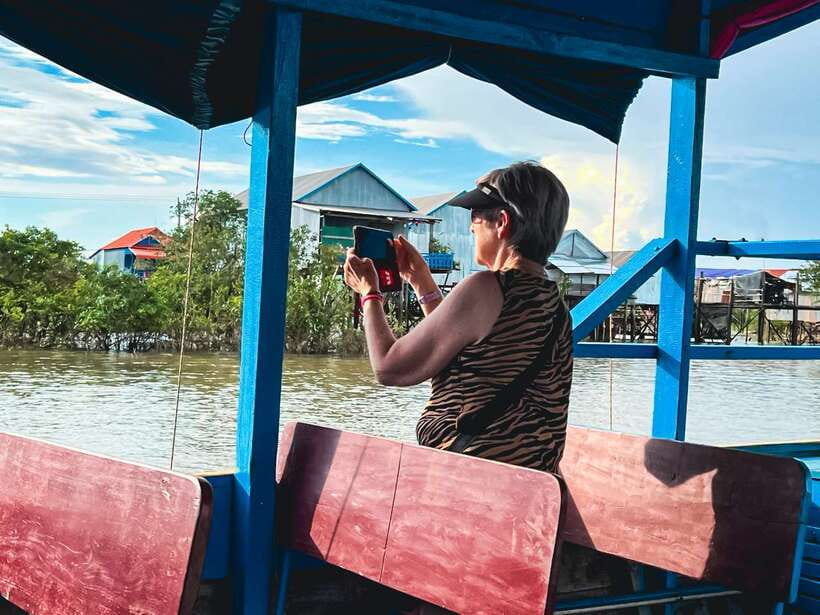 Siem Reap Floating Village Kampong Phluk Sunset with Boat - Walking through a village built on stilts