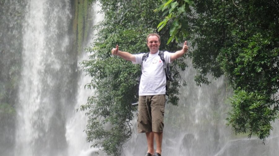 Siem Reap: Magical Kulen Mountain by Cambodiajeep - Swimming beneath a Cambodian waterfall