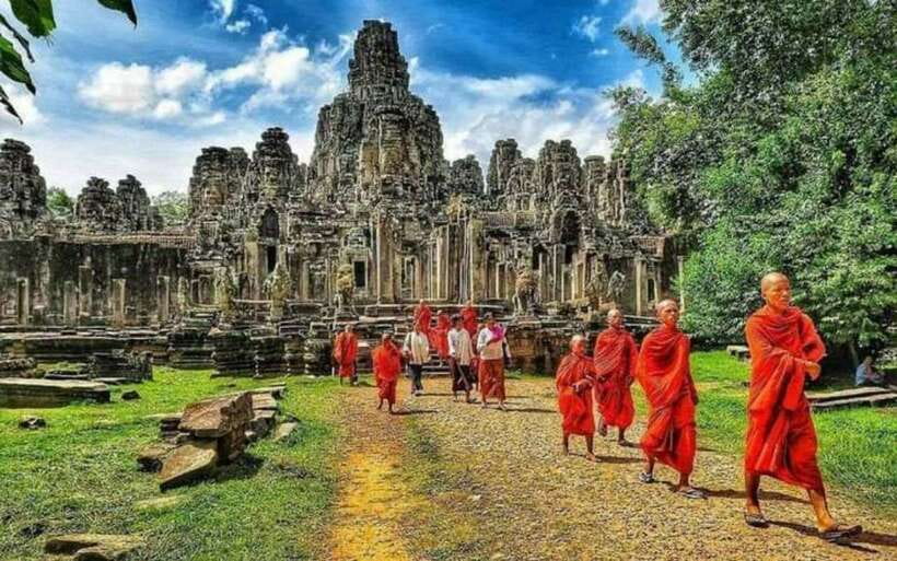 Siem Reap: Personalized Angkor Wat Sunrise/Set by TukTuk/Car - Angkor Wat at sunrise, with clouds as part of the deal